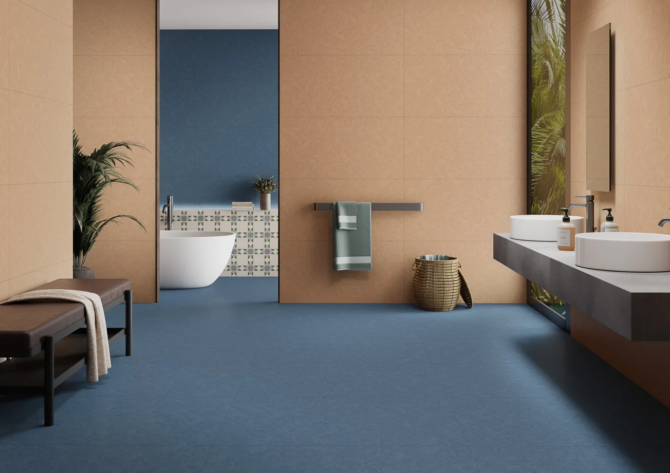 Astica porcelain interior combining blue, warm earth tones and decorative surfaces